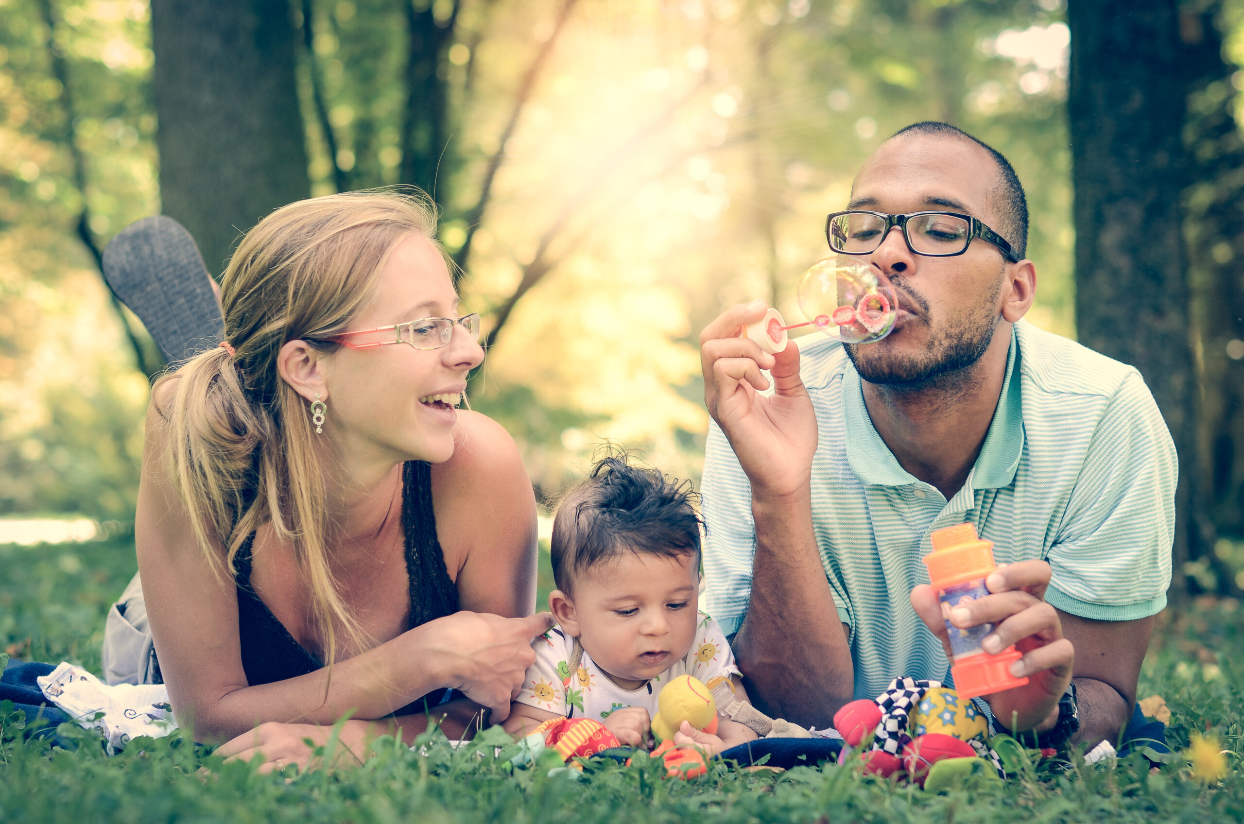 Family Outside Blowing Bubbles